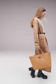 Folleto Longchamp Página 1