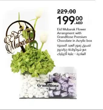 Grandiose Eid Mubarak Flower Arrangment with GrandRose Premium Chocolate in Acrylic box offer