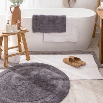 Pillow Talk Resort round bath mat by m.u.s.e. offer