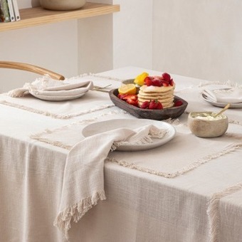 Pillow Talk Ashra fringed beige table linen range by m.u.s.e. offer