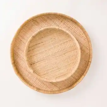 Capri round rattan tray by m.u.s.e.