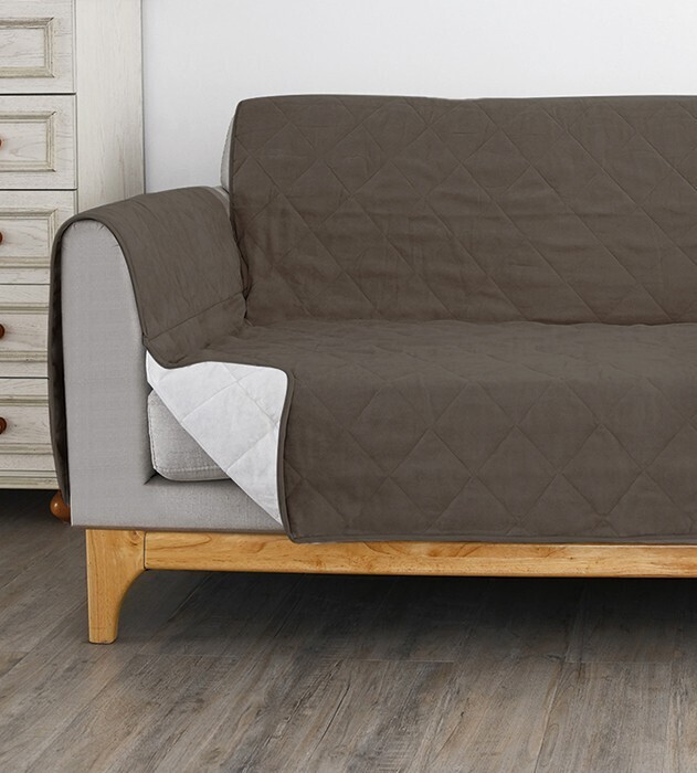 Koo quilted sofa cover offer at Spotlight