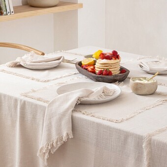 Pillow Talk Ashra fringed beige table linen range by m.u.s.e offer