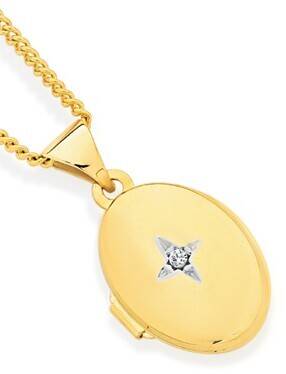Angus & Coote 9ct gold my first diamond oval locket offer