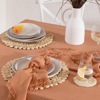 Pillow Talk Ashra Fringed Rust Table Linen Range by M.U.S.E. offer