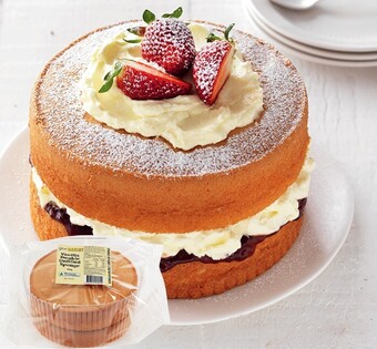 IGA Your Bakery Chocolate or Vanilla Unfilled Sponge Cake 460g offer