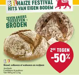 Delhaize Brood, volkoren of walnoten en rozijnen aanbieding