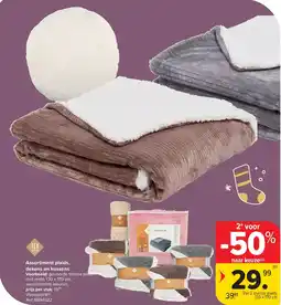 Carrefour Assortiment plaids, dekens en kussens aanbieding