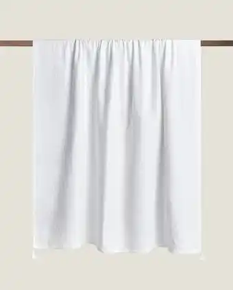 Muslin blanket with tassels