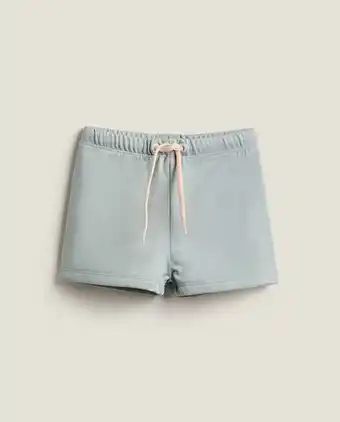 ZARA HOME Boys’ solid color knit swimming trunks offer