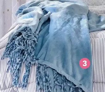 Giant Tiger Flannel throw with tassels offer