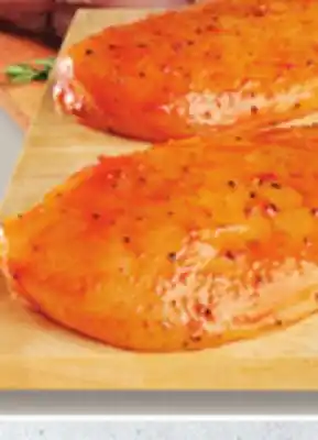 IGA Fresh seasoned chicken breasts offer