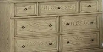 Leon's Emma 7 drawer dresser - oak offer