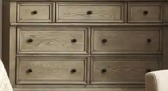 Leon's Emma 7 Drawer Dresser - Oak offer