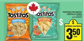 Food Basics TOSTITOS OR HAVOC TORTILLA CHIPS offer