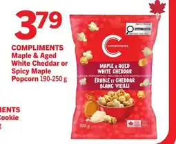Foodland COMPLIMENTS Maple & Aged White Cheddar or Spicy Maple Popcorn offer