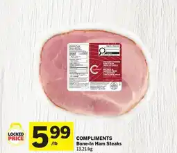 Foodland COMPLIMENTS Bone-In Ham Steaks offer