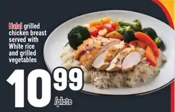 Marché Adonis Halal grilled chicken breast served with White rice and grilled vegetables offer