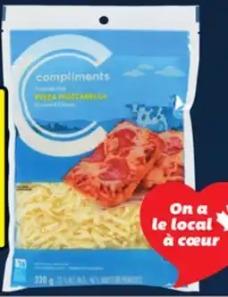 IGA COMPLIMENTS SLICED OR SHREDDED CHEESE offer