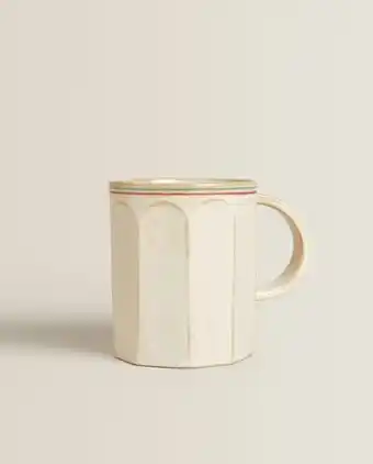 Faceted mug with colored lines