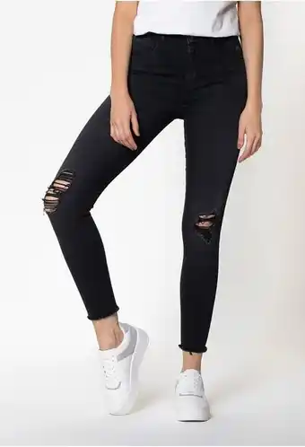 ELA Jean skinny negro tiro alto con ruedo de oferta