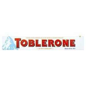 Tamda Foods Toblerone švýcarská bílá čokoláda s medovo-mandlovým nugátem 100g nabídka