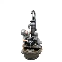 Netto Marken-Discount REGINA - Polyresin, Rustikale Dekoration Junge und Hund am Brunnen Angebot