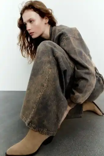 ZARA Wide-leg faded-effect trousers offer