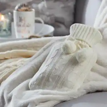 Home Bargains Warm at heart: knitted hot water bottle - cream offer