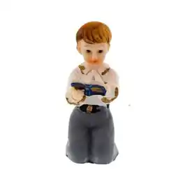 Tesco Ceramic Reading Boy Cake Topper offer