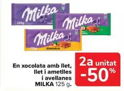 Carrefour Market MILKA En xocolata amb llet, llet i ametlles i avellanes oferta