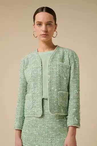 Veste en tweed gansée de perles