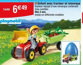 Migros Enfant avec tracteur et remorque tracteur équipé d'une remorque contenant trois carottes Dès 3 ans. offre