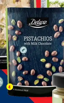 Lidl DELUXE Pistaches ou noix enrobées de chocolat au lait offre