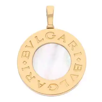 Dije hechura especial con sintéticos firma bvlgari en acero y oro amarillo 18 kilates.