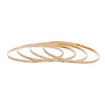 Nacional Monte de Piedad Cuatro pulseras de arillo labradas en oro amarillo 14 kilates. oferta
