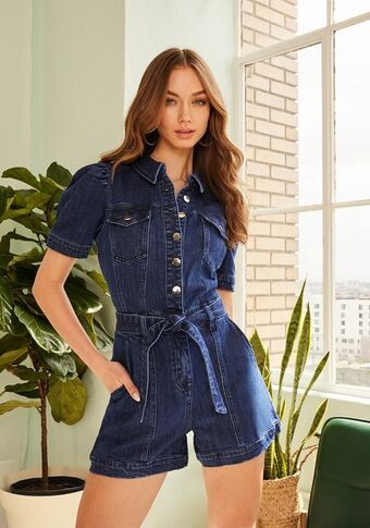 Bebe Button front short sleeve cuffed denim romper oferta