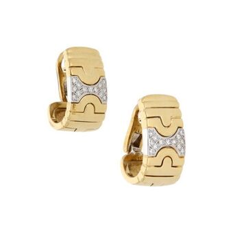 Nacional Monte de Piedad Aretes estilizados con diamantes en oro dos tonos 18 kilates. oferta