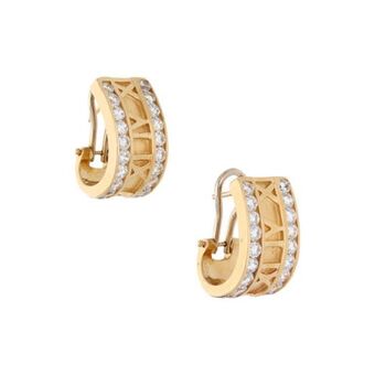 Nacional Monte de Piedad Aretes estilizados motivo números romanos con circonias en oro dos tonos 14 kilates. oferta