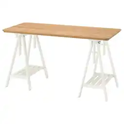 IKEA Een wit anfallare bureau met een houten blad, voorzien van schraagpoten en een plank eronder aanbieding