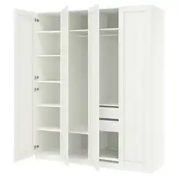 IKEA Een witte ikea pax kledingkast met open deuren, die lege planken en lades onthullen aanbieding