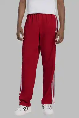 Wehkamp adidas Originals trainingsbroek Firebird rood/wit aanbieding