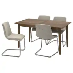 IKEA Een set van vier met stof beklede stoelen en een uitschuifbare houten tafel aanbieding
