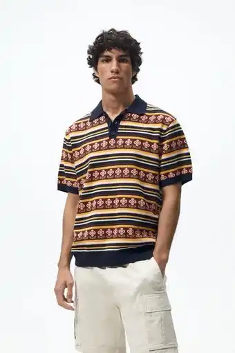 Strikket polo i jacquard med blomster