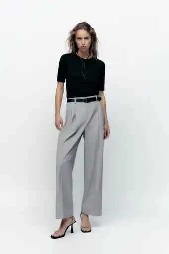 ZARA Bukse med legg og belte tilbud