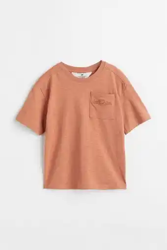 H&M Polo oversize con bolsillo superior oferta