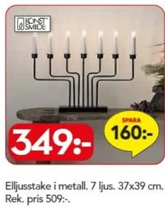 Elljusstake i metall. 7 ljus. 37x39 cm