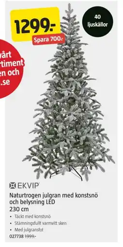 Jula Naturtrogen julgran med konstsnö och belysning LED erbjuda