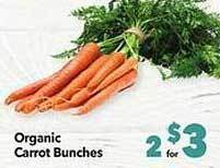 Vallarta Supermarkets Organic carrot bunches offer
