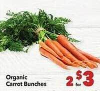 Vallarta Supermarkets Organic carrot bunches offer